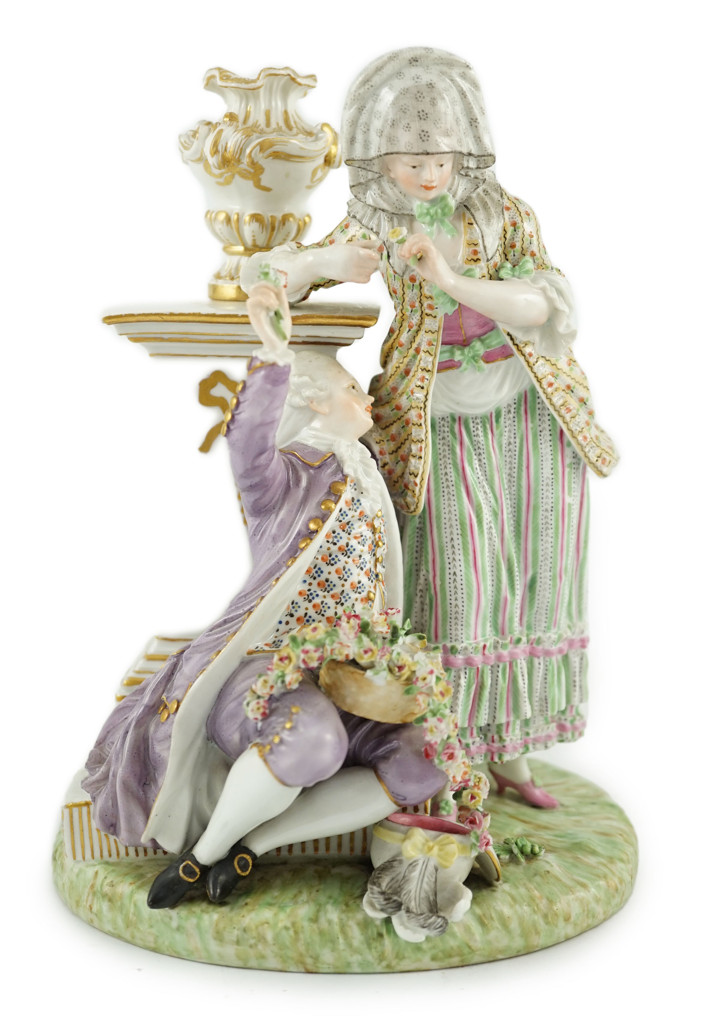 A Meissen porcelain group of a maid and a gallant by a pedestal, 19th century, 22cm high, crack to base